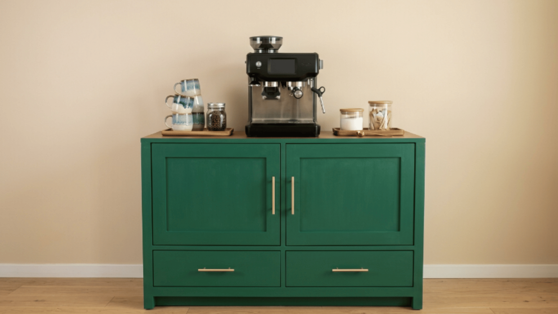 emerald green coffee cabinet with mugs trays jars and organized coffee setup