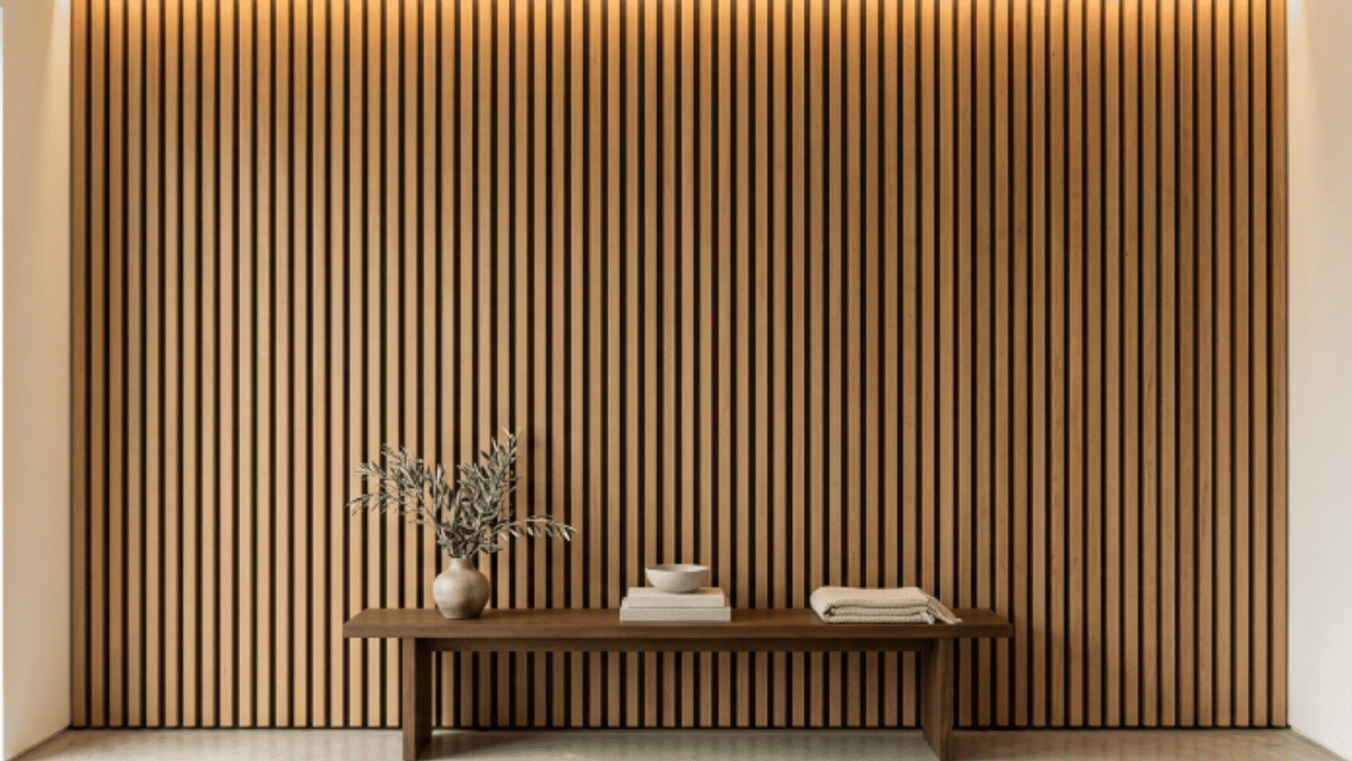 vertical wood slat feature wall with warm tones in a clean modern interior