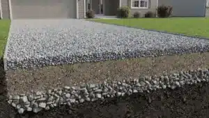 Cross-section of a gravel driveway showing base, binder, and surface layers for a durable residential installation.