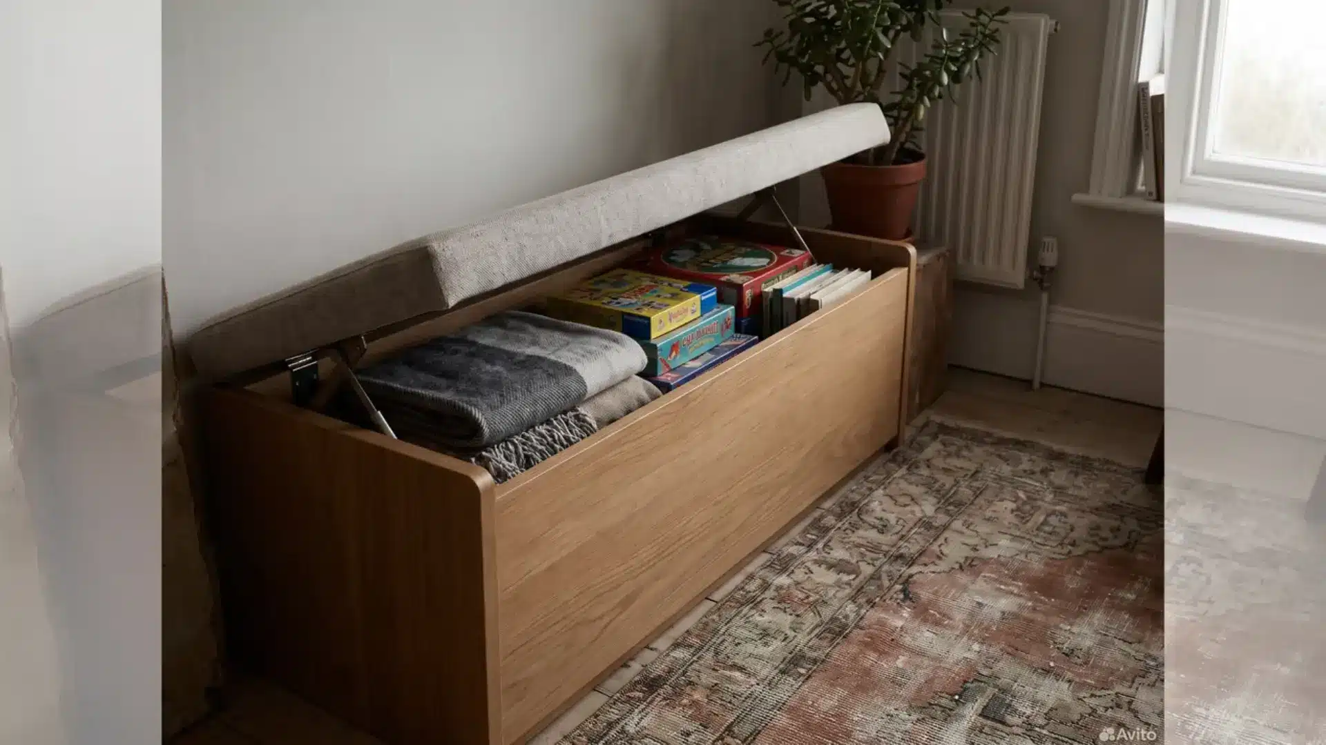 storage bench with a lift up seat shown slightly open