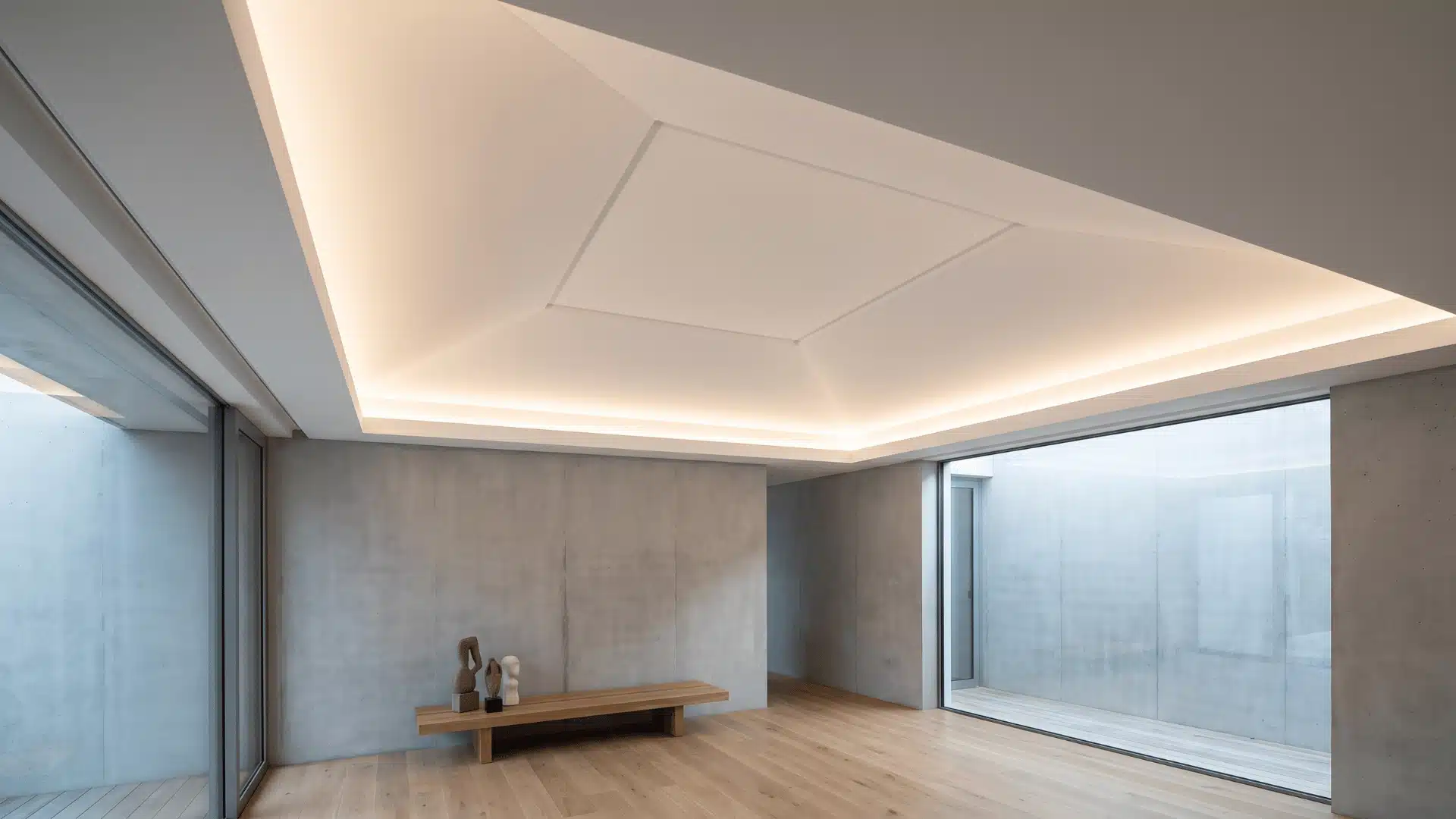 Modern room with frameless tray ceiling showing sharp seamless edges and clean architectural ceiling planes