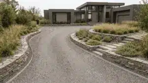 Modern home with a clean gravel driveway leading to the entrance, showing a structured and well-maintained outdoor space.