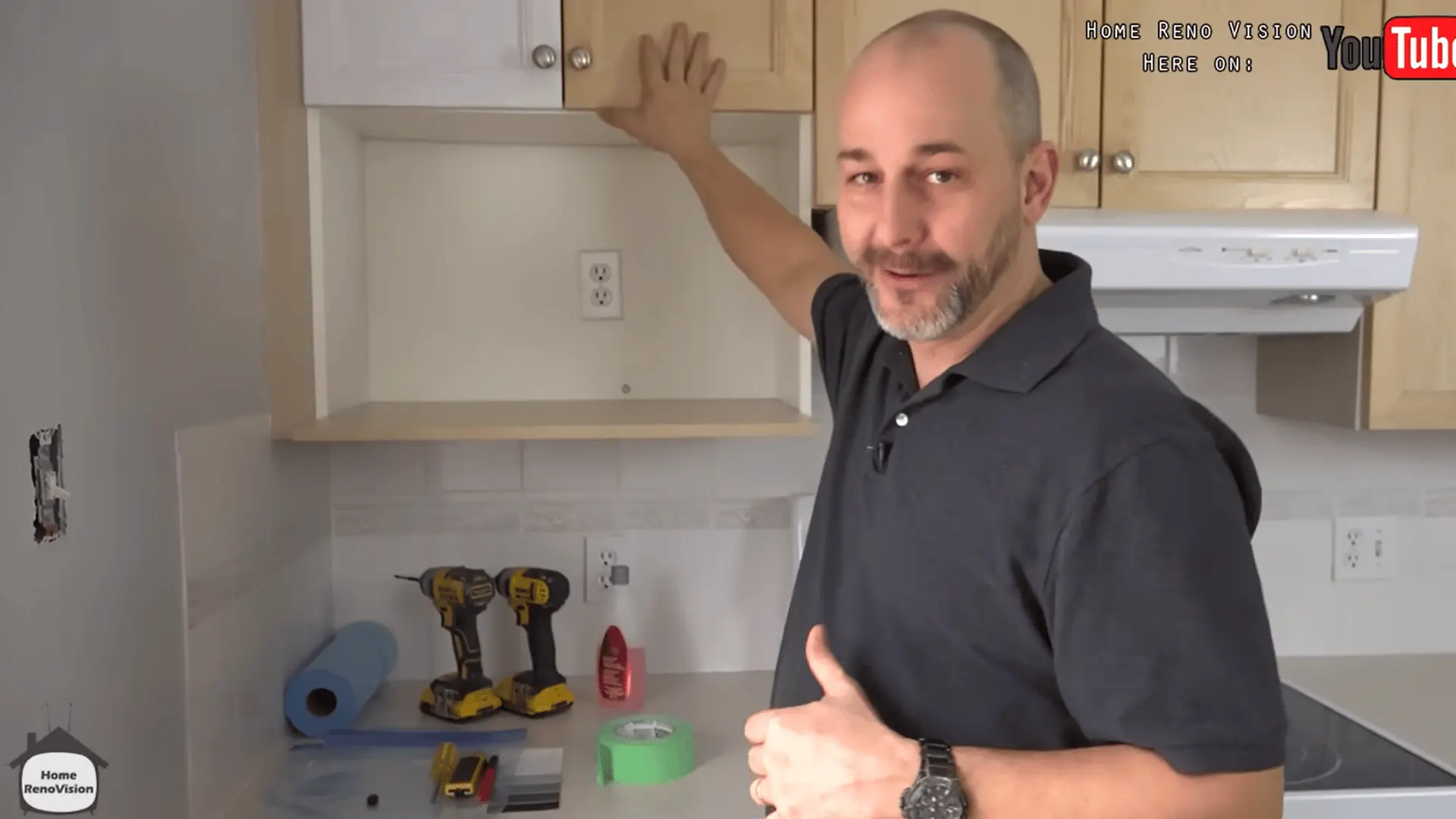 Inspecting kitchen cabinet doors to identify their material and existing finish before painting.