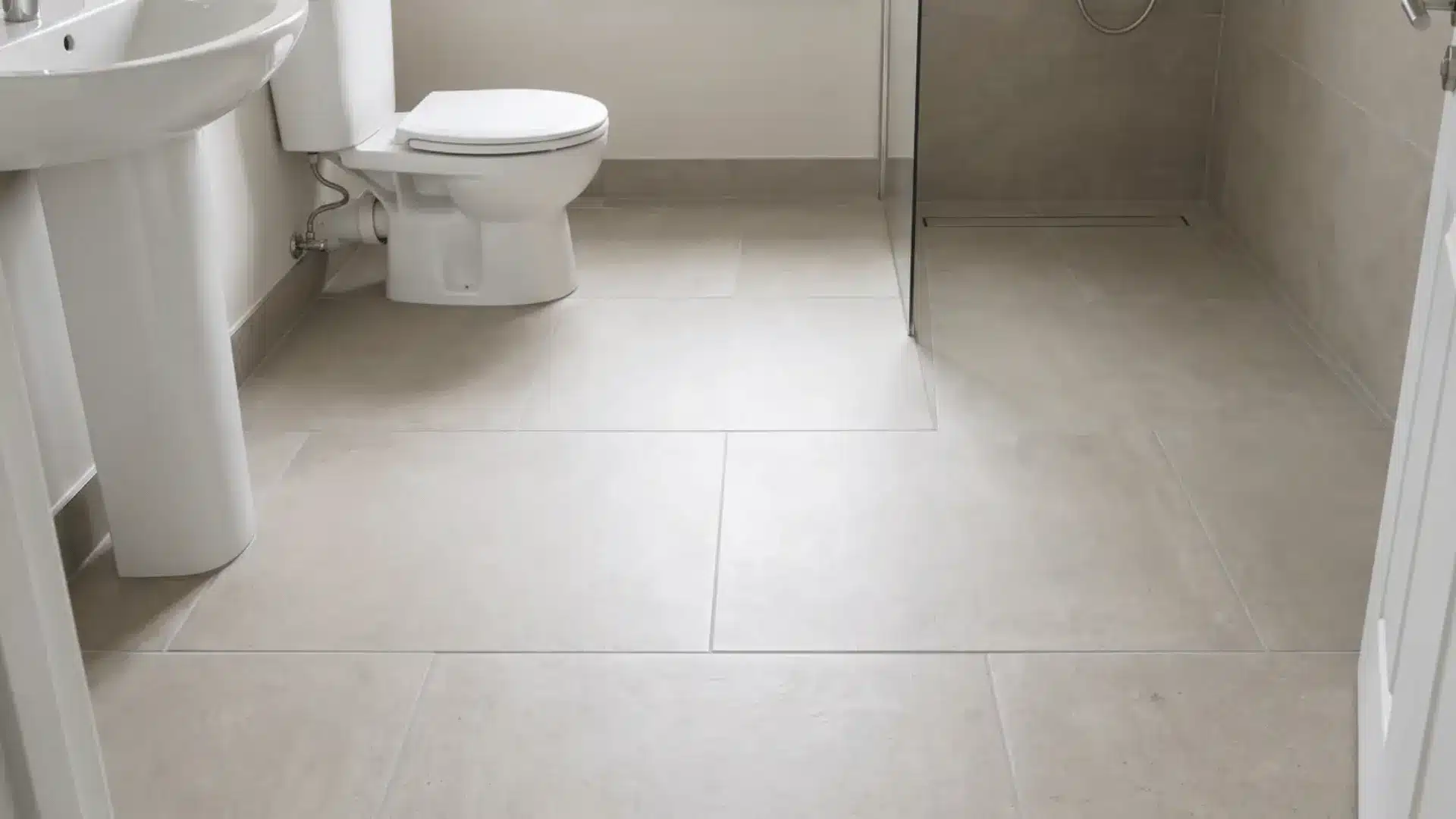 Large format tiles across small bathroom floor