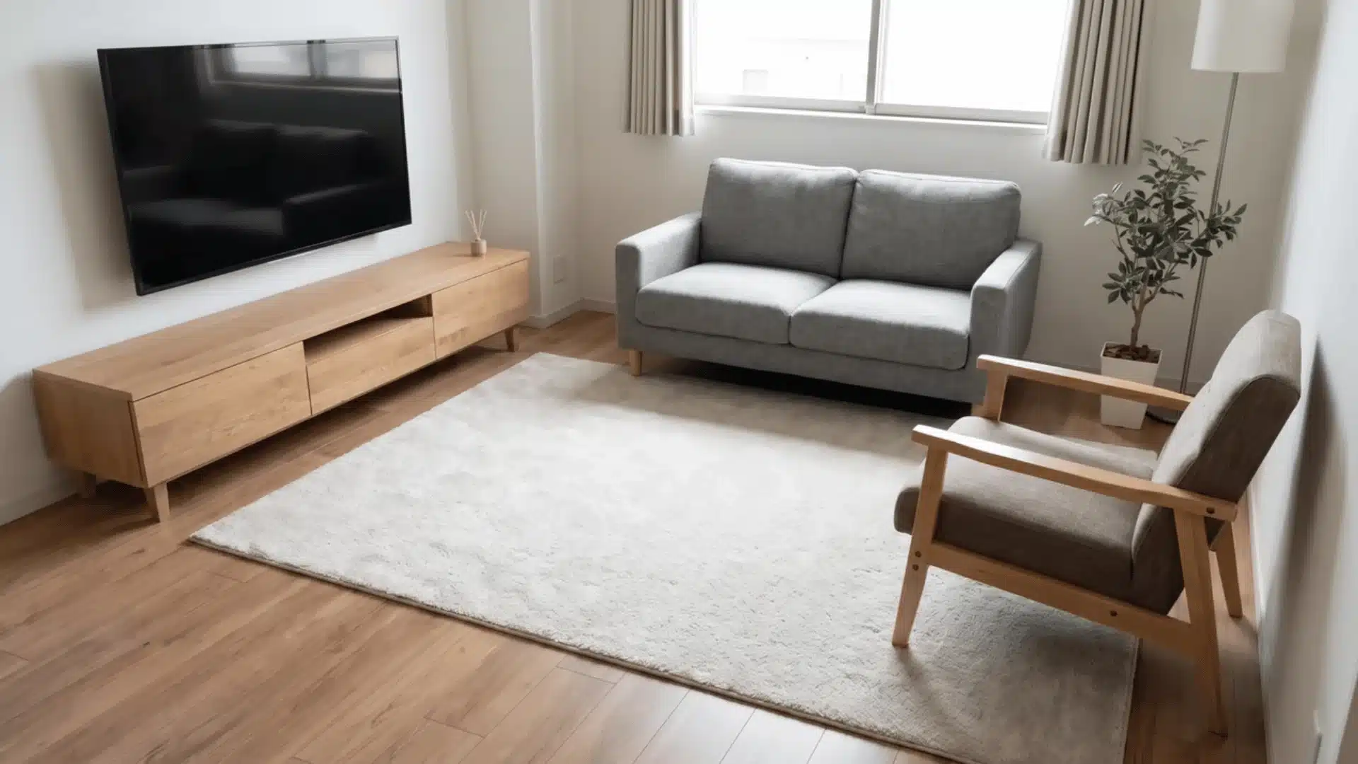Small living room with loveseat, accent chair, and TV with open walking space